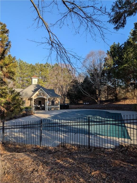 view of swimming pool with a fenced in pool, fence, and a patio area
