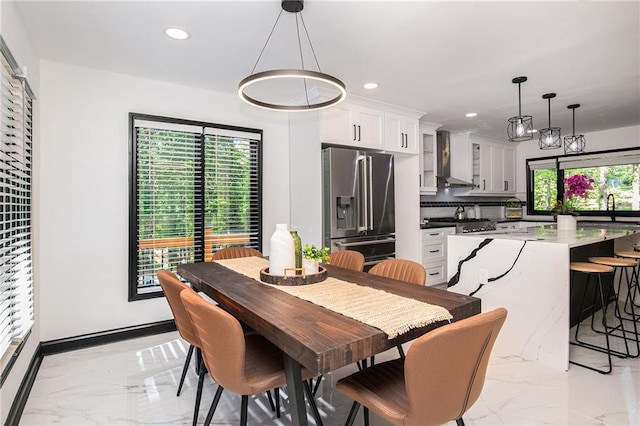 2432 Thompson Mill Rd, Gainesville, GA 30506 - dining space with light marble finish flooring, recessed lighting, and baseboards
