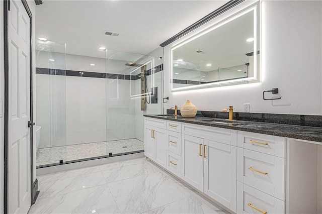 2432 Thompson Mill Rd, Gainesville, GA 30506 - bathroom featuring vanity, tiled shower, and marble look tile flooring
