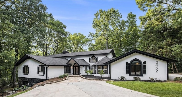 2432 Thompson Mill Rd, Gainesville, GA 30506 - view of front facade featuring stucco siding and a front yard