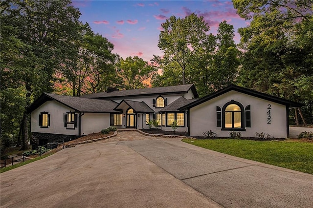2432 Thompson Mill Rd, Gainesville, GA 30506 - view of front of house featuring a front lawn, stucco siding, and driveway