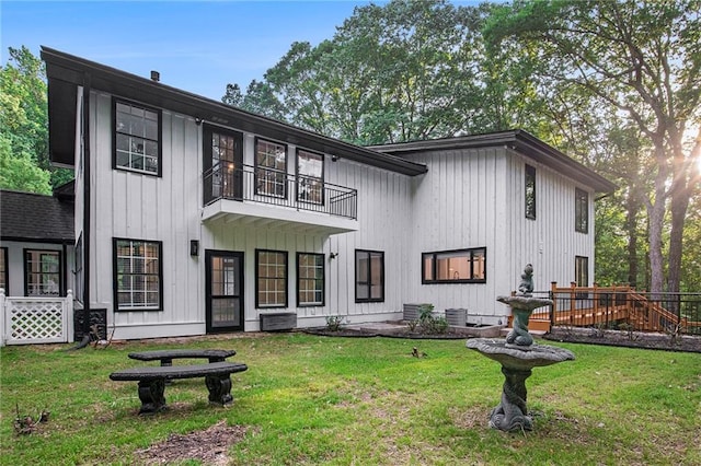 2432 Thompson Mill Rd, Gainesville, GA 30506 - view of front of home with a balcony, a front yard, and board and batten siding