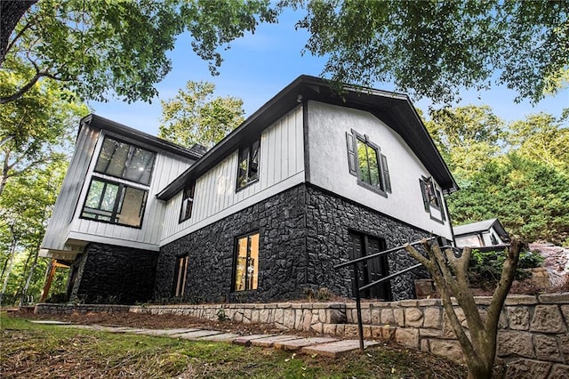 2432 Thompson Mill Rd, Gainesville, GA 30506 - view of side of property featuring stone siding and board and batten siding