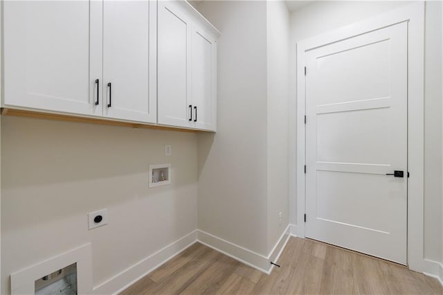 clothes washing area with washer hookup, electric dryer hookup, baseboards, light wood-type flooring, and cabinet space