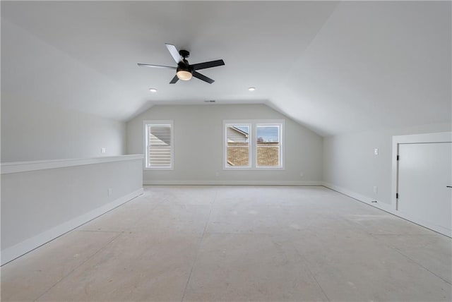 bonus room with lofted ceiling, ceiling fan, and baseboards
