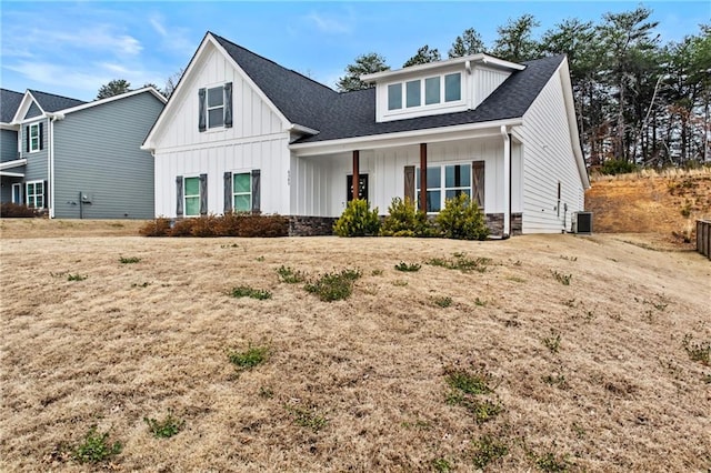 modern inspired farmhouse with a shingled roof, cooling unit, and board and batten siding