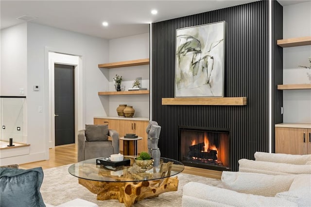 942 Fairfield, Marietta, GA 30068 - living area featuring light wood-style floors, a lit fireplace, and recessed lighting