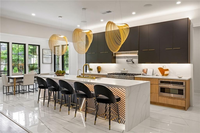 942 Fairfield, Marietta, GA 30068 - kitchen featuring stainless steel appliances, modern cabinets, a sink, light countertops, and recessed lighting