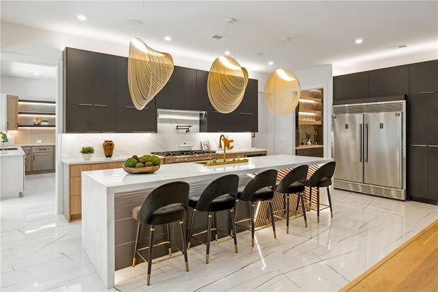 942 Fairfield, Marietta, GA 30068 - kitchen with stainless steel appliances, modern cabinets, a sink, light marble finish flooring, and recessed lighting