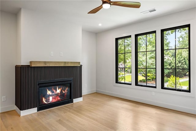942 Fairfield, Marietta, GA 30068 - unfurnished living room with wood finished floors, baseboards, ceiling fan, recessed lighting, and a glass covered fireplace