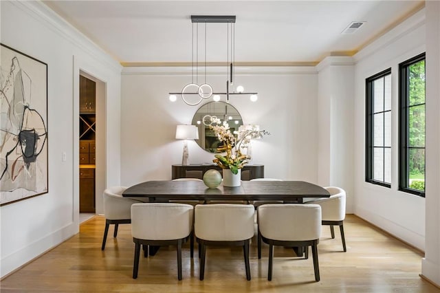 942 Fairfield, Marietta, GA 30068 - dining space featuring light wood-style floors, a chandelier, crown molding, and baseboards