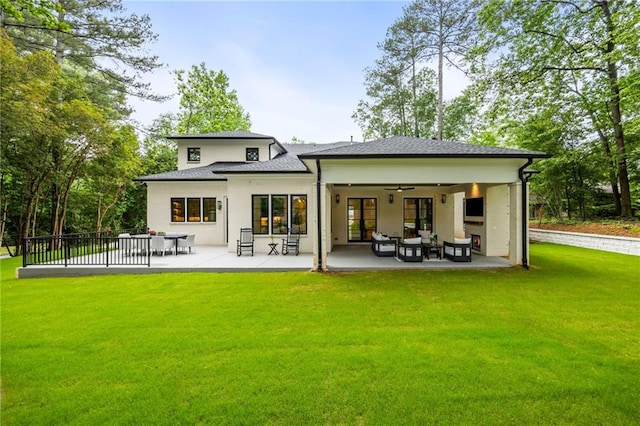 942 Fairfield, Marietta, GA 30068 - back of property featuring a yard, a patio area, a ceiling fan, and an outdoor hangout area