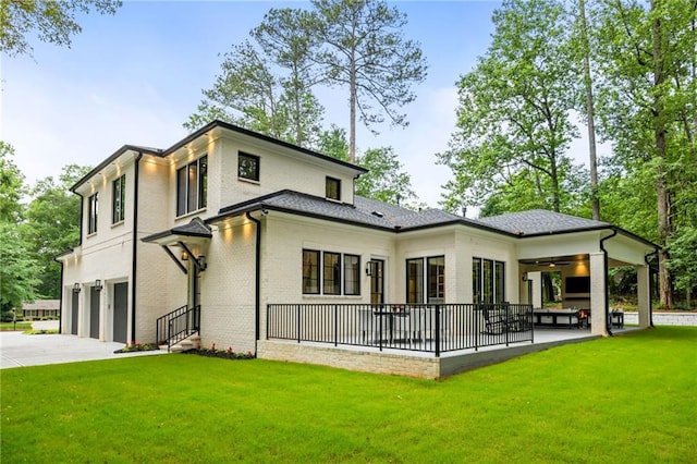 942 Fairfield, Marietta, GA 30068 - back of property with an attached garage, a yard, brick siding, and concrete driveway