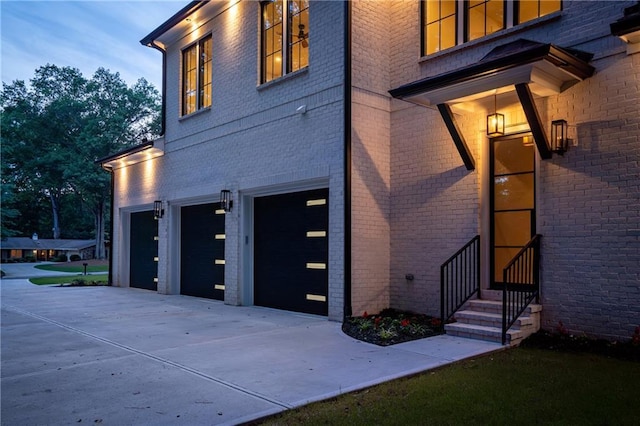942 Fairfield, Marietta, GA 30068 - view of side of property with an attached garage, brick siding, and driveway