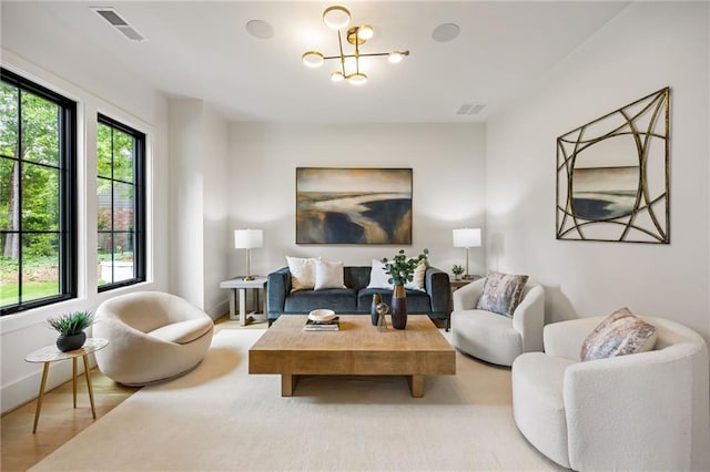 942 Fairfield, Marietta, GA 30068 - living room featuring a chandelier, wood finished floors, and baseboards