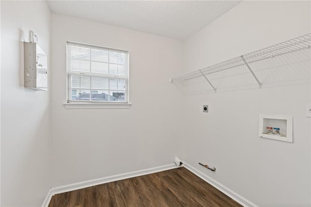 laundry area featuring hookup for a washing machine, gas dryer hookup, electric dryer hookup, and dark hardwood / wood-style floors