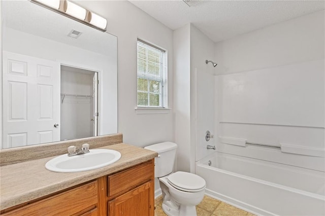 full bathroom featuring vanity, a textured ceiling, bathtub / shower combination, and toilet