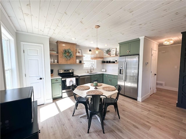 kitchen with open shelves, crown molding, stainless steel appliances, and green cabinetry