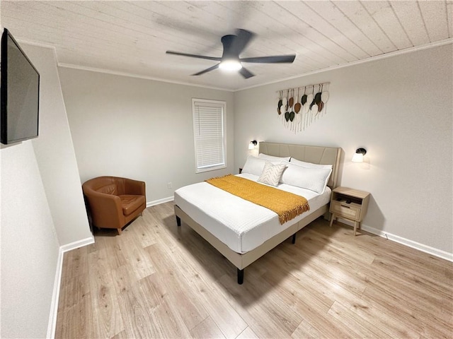 bedroom featuring baseboards, wood ceiling, ornamental molding, light wood-style flooring, and a ceiling fan