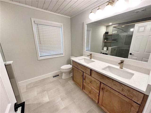 full bath featuring a sink, toilet, a shower stall, and crown molding