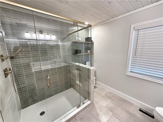 full bath featuring toilet, a stall shower, ornamental molding, baseboards, and wood ceiling