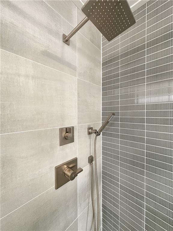 bathroom with a tile shower