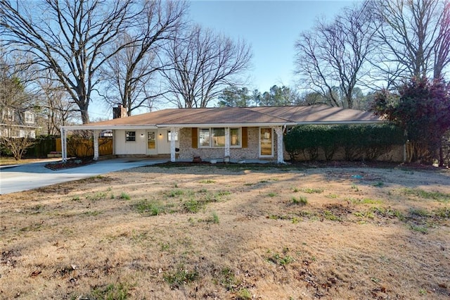 ranch-style home with a carport