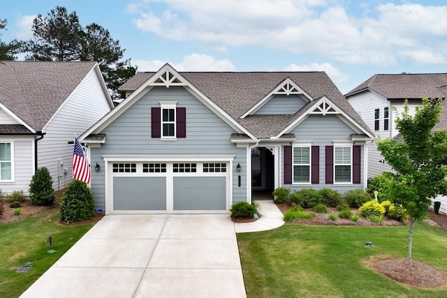 craftsman-style home featuring a garage and a front yard