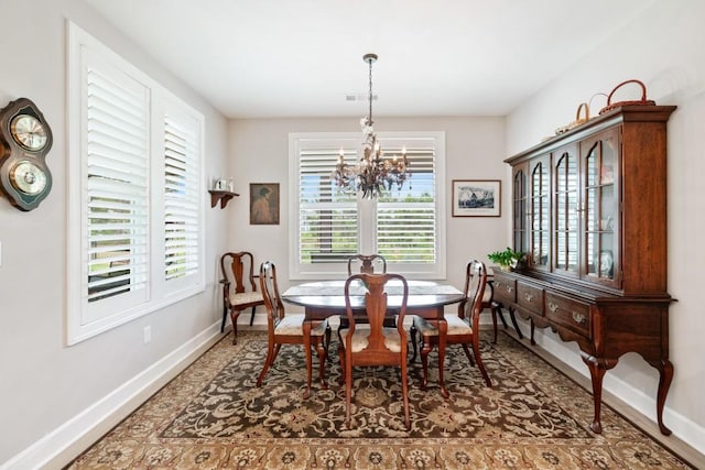 dining area featuring a chandelier