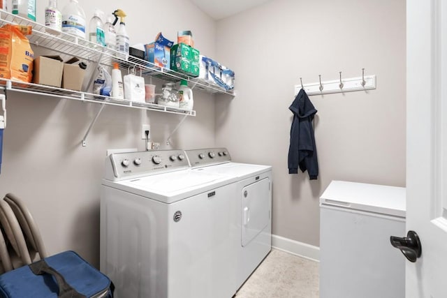 laundry room featuring separate washer and dryer