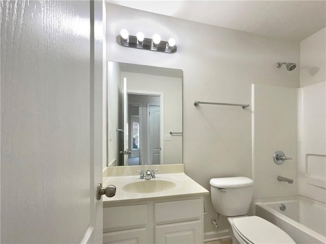 full bathroom featuring bathtub / shower combination, vanity, and toilet