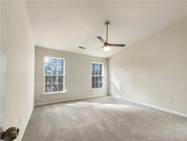 carpeted empty room with ceiling fan