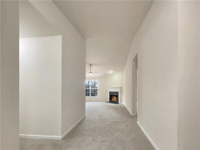 hallway featuring light carpet