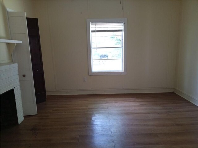 2205 Buchanan Hwy, Cedartown, GA 30125 - unfurnished room with wood finished floors and a fireplace