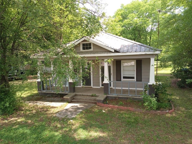 2205 Buchanan Hwy, Cedartown, GA 30125 - view of front of home with covered porch, metal roof, and a front yard