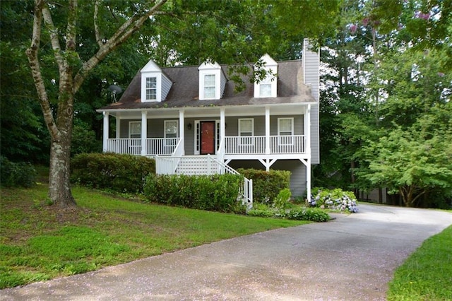 55 Legend Creek Cv, Douglasville, GA 30134 - new england style home with a porch, stairway, a chimney, and a front yard