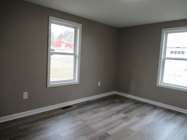 empty room featuring hardwood / wood-style flooring