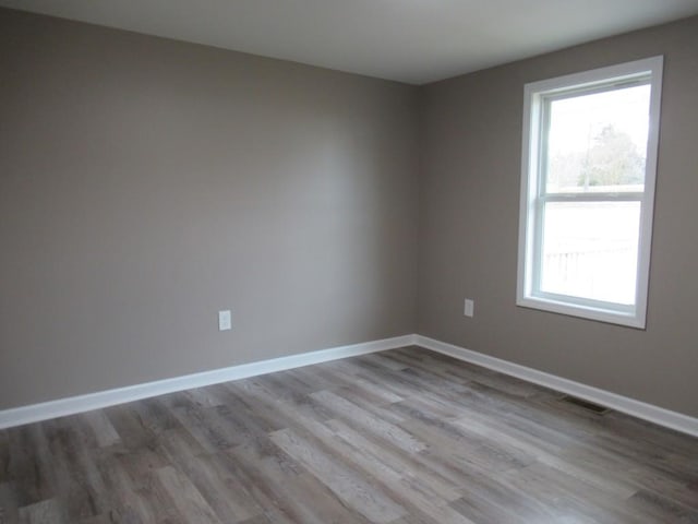 unfurnished room featuring light hardwood / wood-style floors