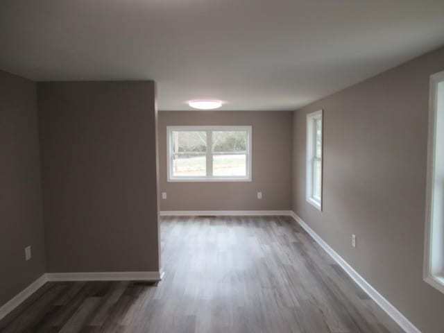 unfurnished room featuring dark hardwood / wood-style floors