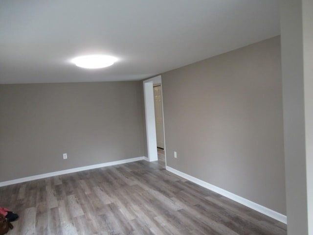 spare room with light hardwood / wood-style floors