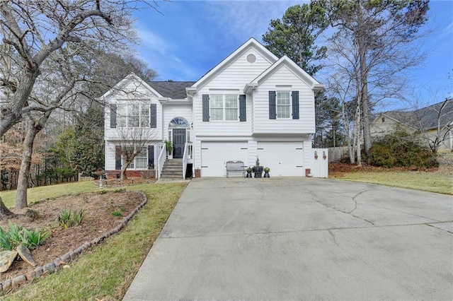 split foyer home with a garage and driveway