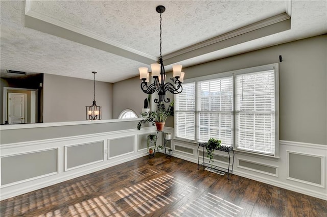 4184 Wyndham Park Way, Buford, GA 30519 - dining area featuring a chandelier, wood finished floors, a decorative wall, a textured ceiling, and a wainscoted wall
