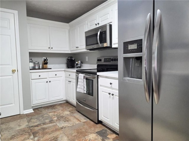 4184 Wyndham Park Way, Buford, GA 30519 - kitchen featuring stainless steel appliances, stone finish flooring, white cabinets, and light countertops