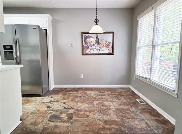 4184 Wyndham Park Way, Buford, GA 30519 - unfurnished dining area featuring baseboards and stone finish floors