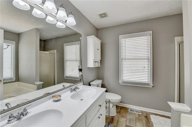 full bathroom featuring a sink, visible vents, and a shower stall