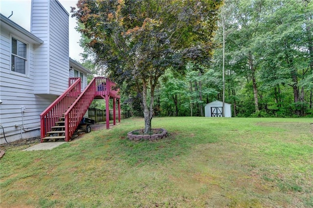 4184 Wyndham Park Way, Buford, GA 30519 - view of grassy yard with a storage unit, stairway, an outbuilding, and a wooden deck