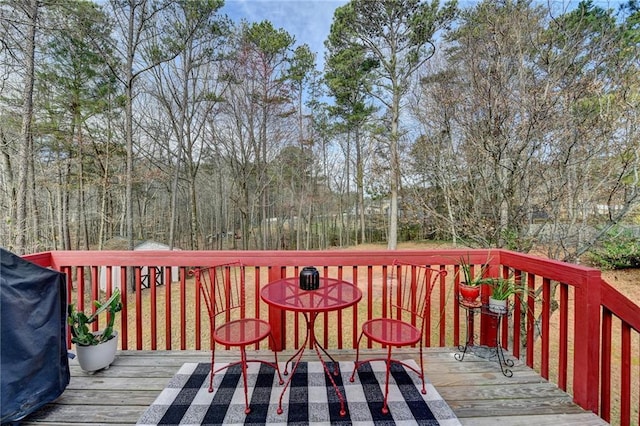 wooden deck with grilling area