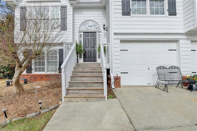 view of exterior entry with a garage