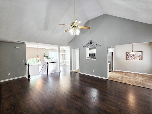 4184 Wyndham Park Way, Buford, GA 30519 - unfurnished living room with ceiling fan, high vaulted ceiling, wood finished floors, a chandelier, and baseboards