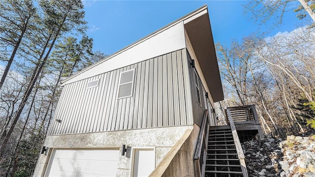 view of side of property featuring a garage